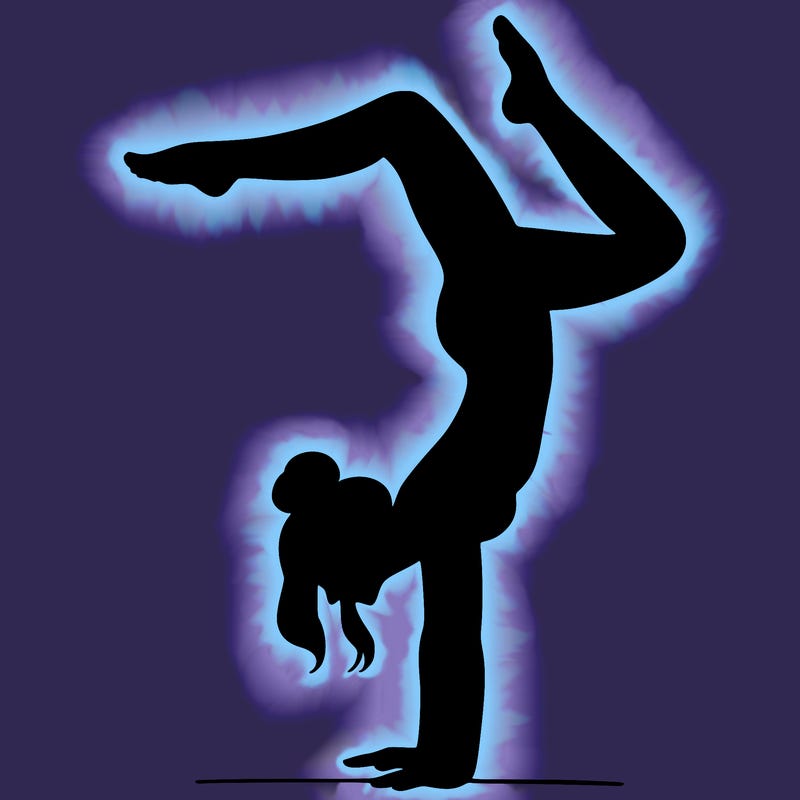 a woman doing a handstand
