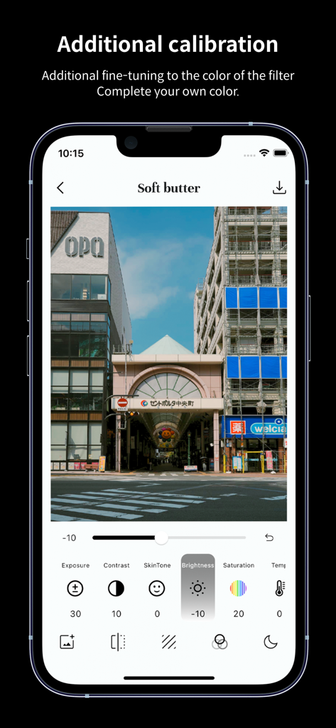 Interface of the FilmN photo editing app showing calibration tools like brightness and contrast applied to a travel photo with a soft butter filter.