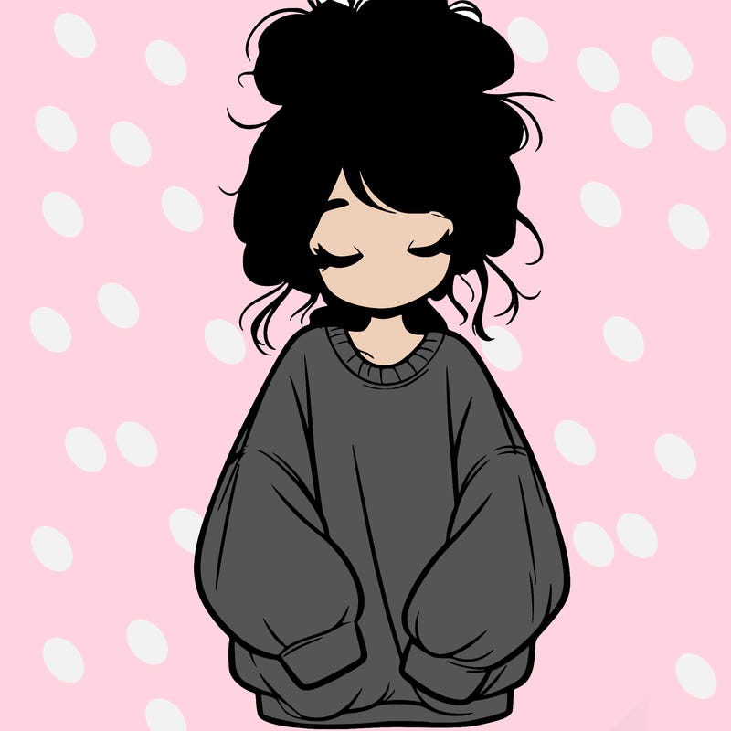 girl with baggy sweatshirt and messy bun