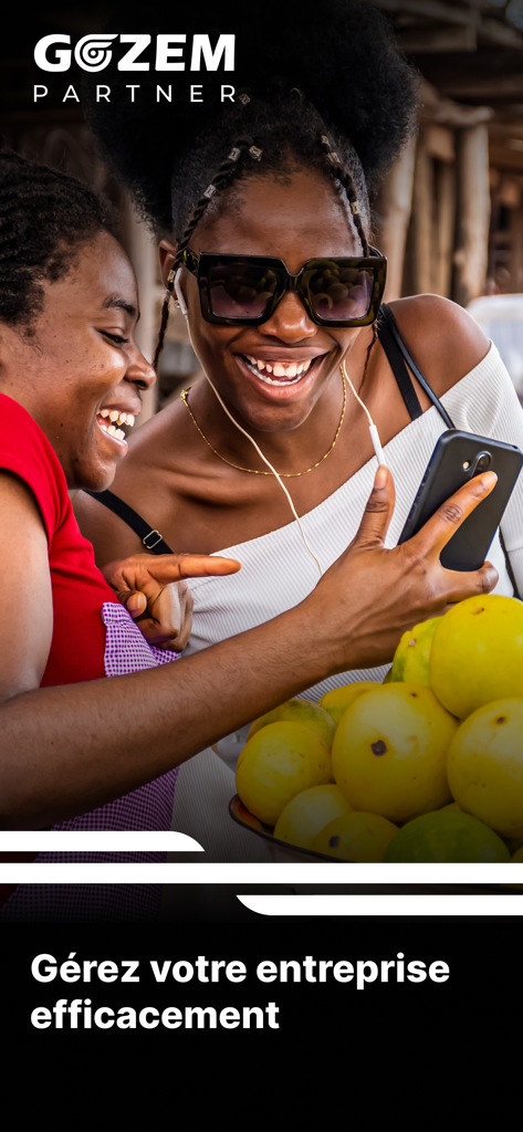 Gozem Marchand - Two female entrepreneurs smiling while using the Gozem Marchand app on a smartphone to manage their business