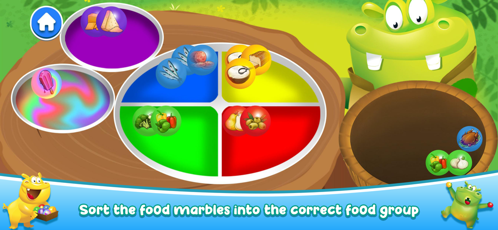 A preschool educational screen showing food marbles being sorted into correct food groups on a colorful plate with a green hippo character.