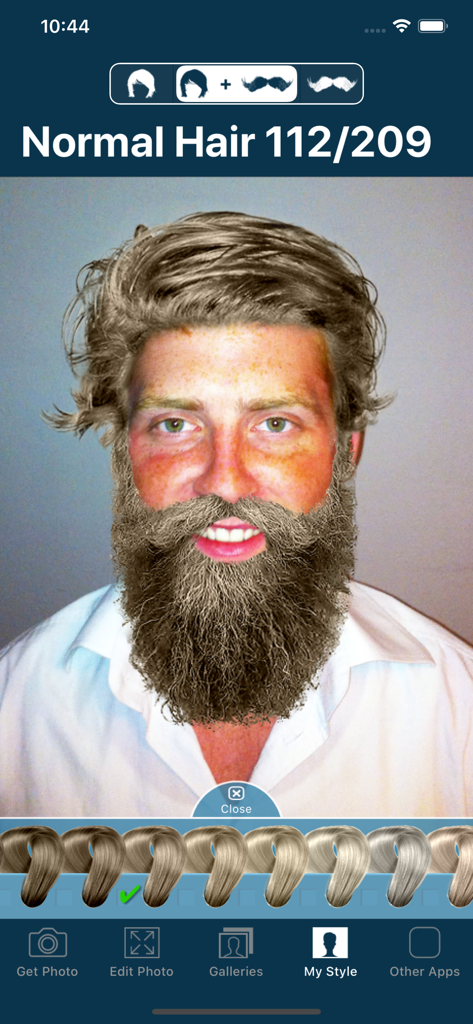 Interface of the Hair and Beard Styles app showing a man virtually trying on a blonde hairstyle and a full beard