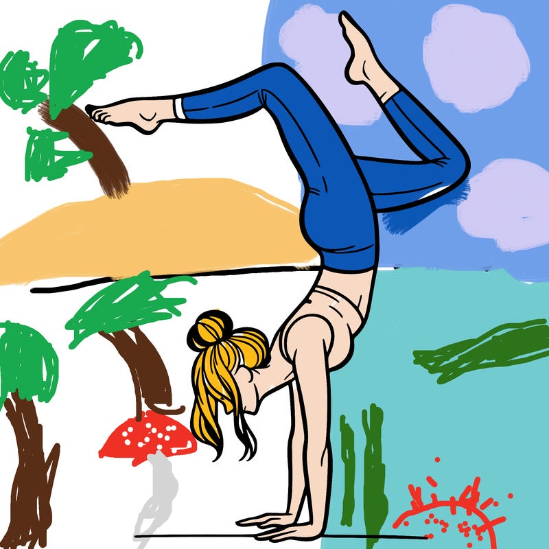 a woman doing a handstand