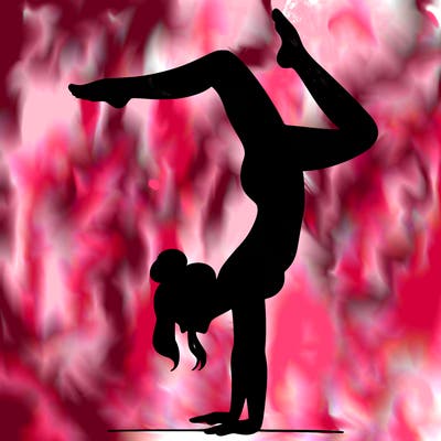 a woman doing a handstand