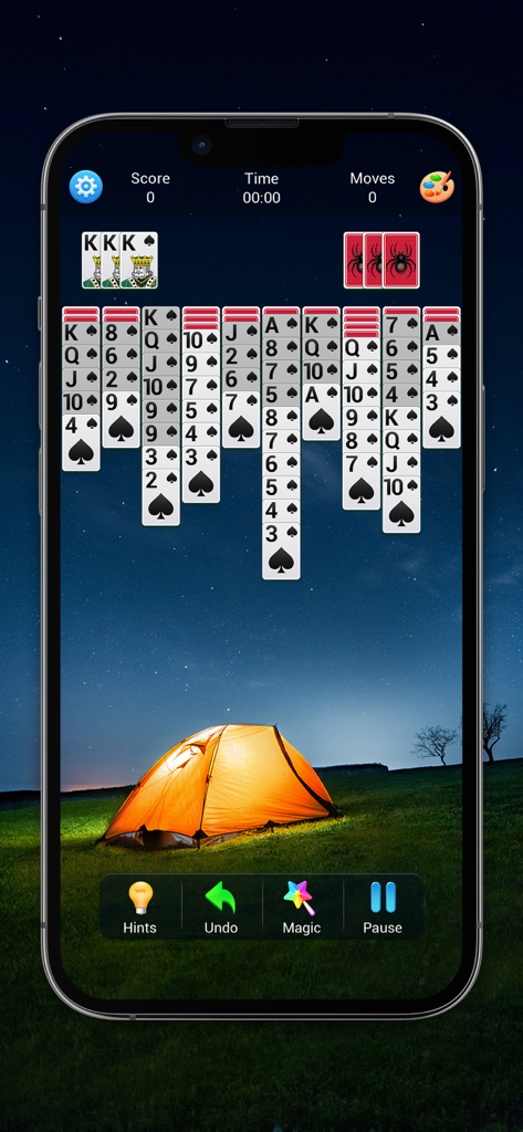 Spider Solitaire classic gameplay featuring a glowing tent under a starry sky background