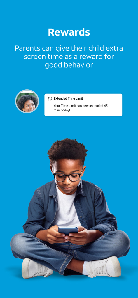 A young boy using a smartphone with a notification for an extended screen time reward from parents
