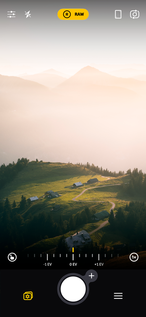 Camera plus app interface showing RAW capture mode and manual exposure settings on a mountain landscape