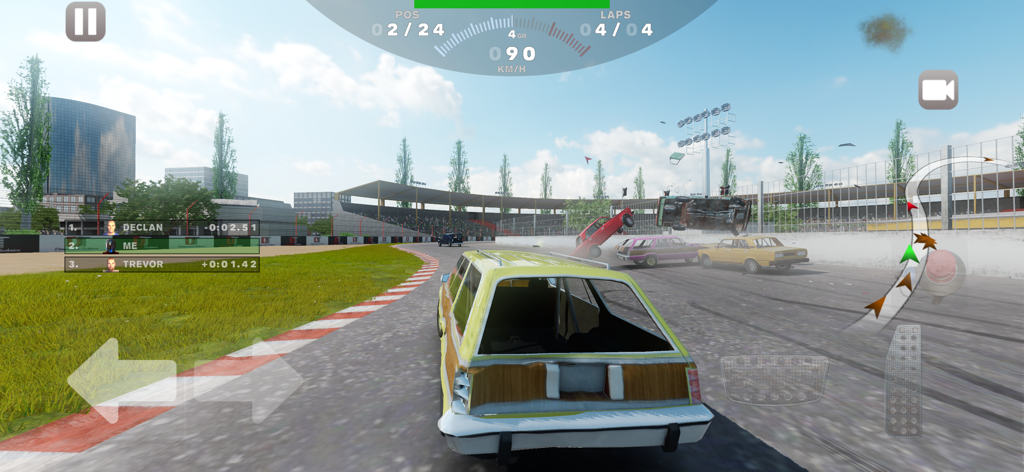 Gameplay screenshot of Derby Madness showing a yellow station wagon racing on a track with multiple cars crashing in the background.