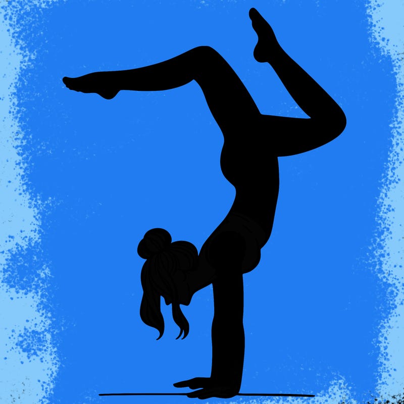 a woman doing a handstand