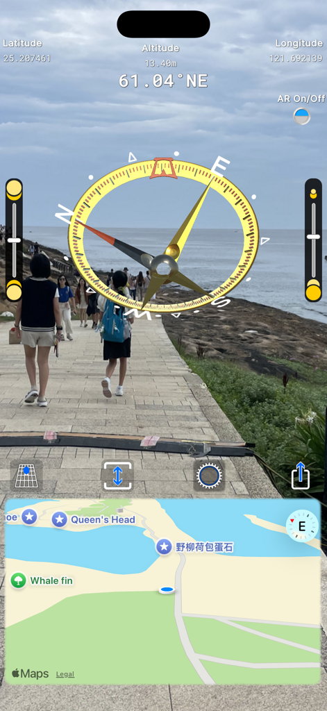 CompassTip mobile app interface showing an augmented reality 3D compass and map overlay on a live camera view