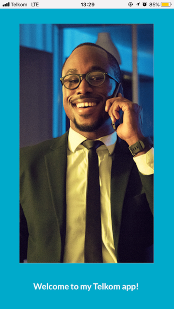 My Telkom - Smiling businessman making a call on the My Telkom app welcome screen