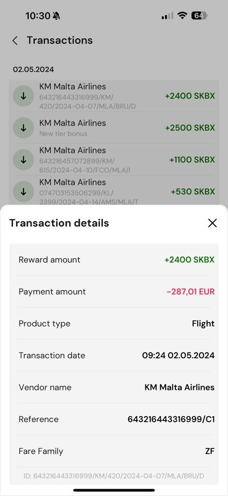 KM Rewards - A mobile screen showing the transaction details for a flight including reward points and payment amount on the KM Rewards app