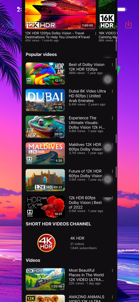 Stitch Photos. - Uma longa captura de tela vertical costurada mostrando um feed de vídeo móvel com vários vídeos HDR de viagens e natureza