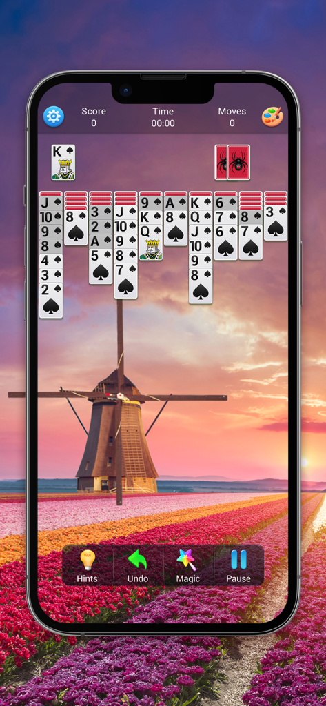 Classic Spider Solitaire gameplay featuring large font cards and a scenic windmill background over a tulip field.