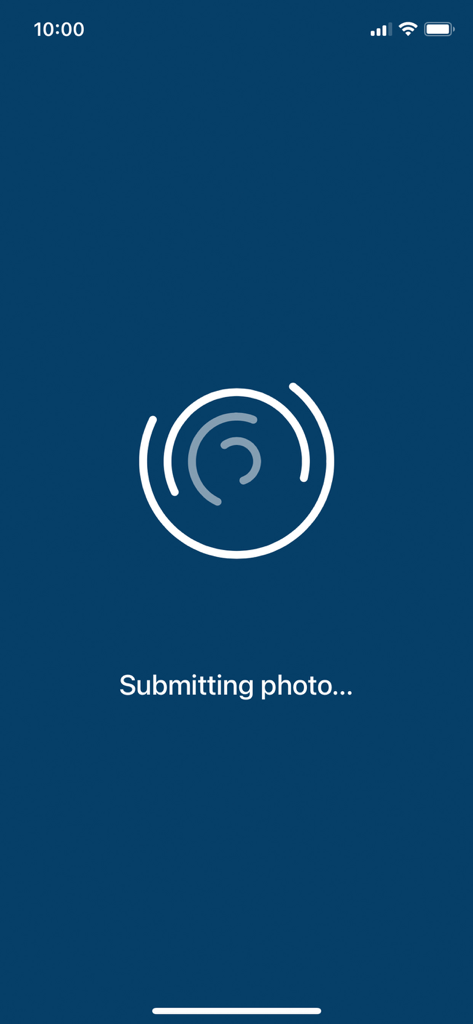Dermos - A dark blue screen in the Dermos app with a white circular loading icon and text that says Submitting photo