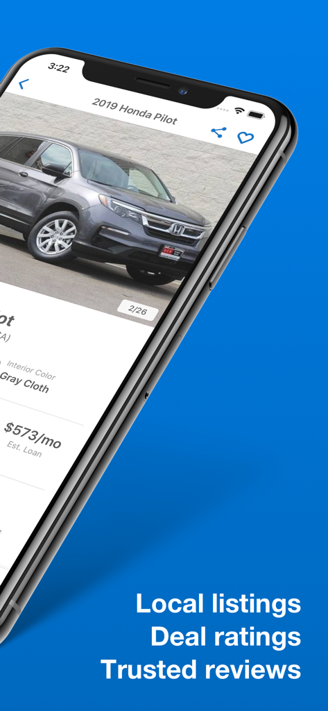 Smartphone screen displaying a car listing on the Edmunds app with price and local inventory details