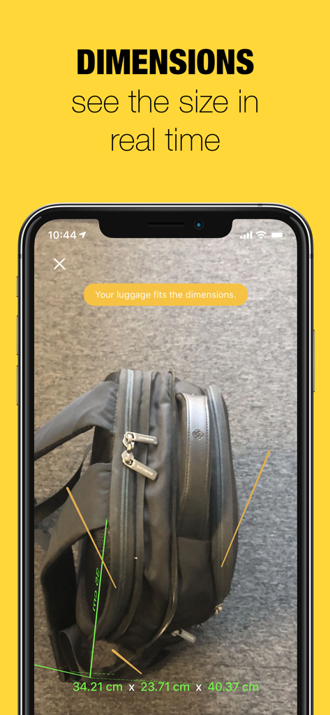 A smartphone using augmented reality to measure a black backpack with real time dimensions displayed on screen