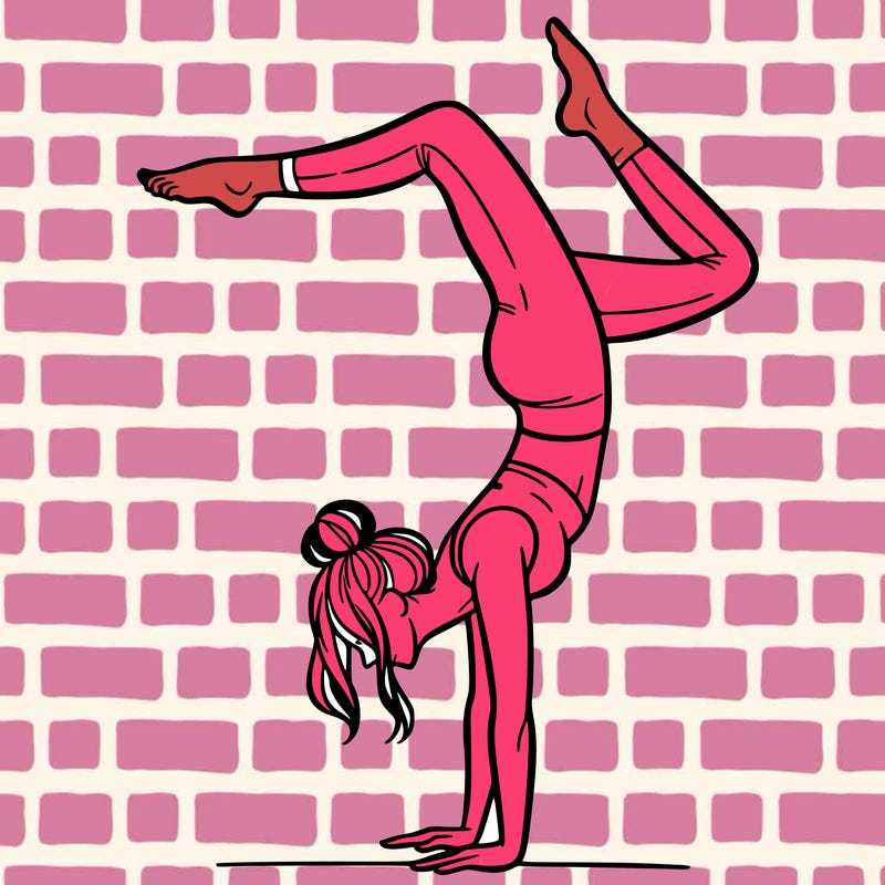 a woman doing a handstand