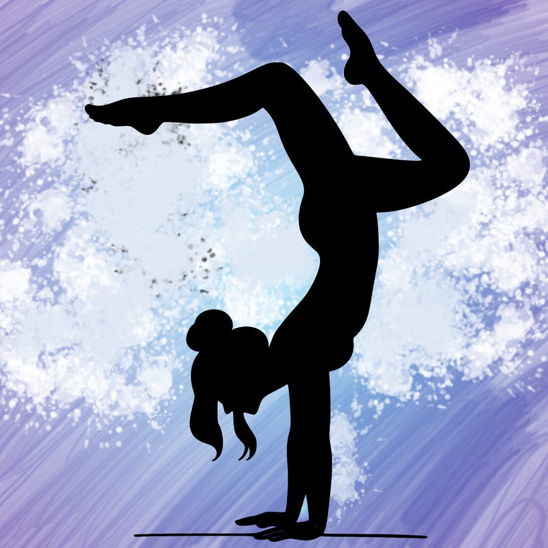 a woman doing a handstand