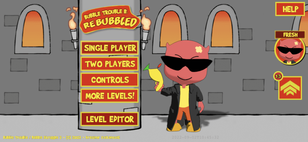 Main menu of Bubble Struggle 2 game showing single player and two player modes with an imp character holding a harpoon gun.