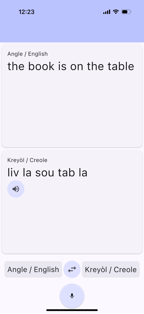 Tradwi Kreyòl - Interface of Tradwi Kreyol app showing English to Haitian Creole translation of the phrase the book is on the table