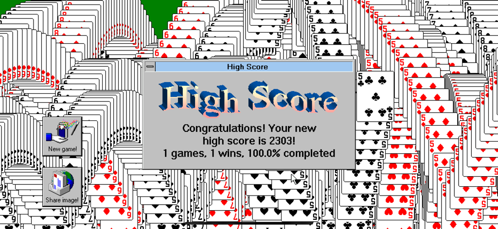 Retro solitaire winning screen with cascading cards and a high score pop up window in 90s computer style