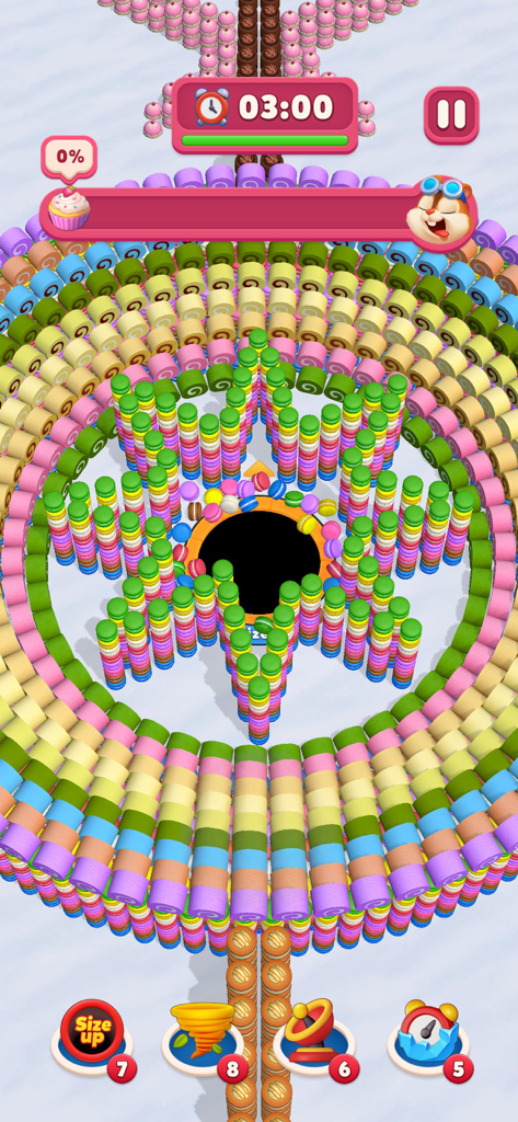 Ever Eater 3D - Gameplay di Ever Eater 3D che mostra un buco nero inghiottire colorati macarons e rotoli di torta