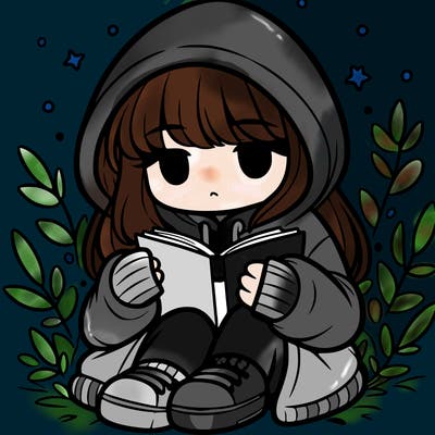 girl in oversized hoodie reading a book