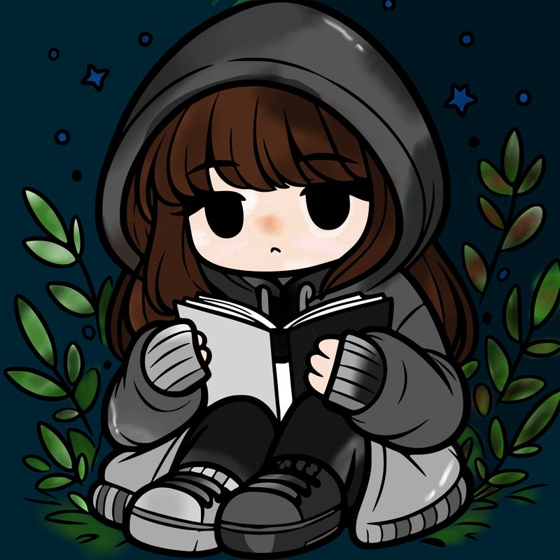 girl in oversized hoodie reading a book