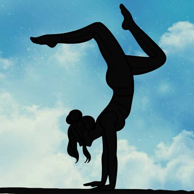a woman doing a handstand