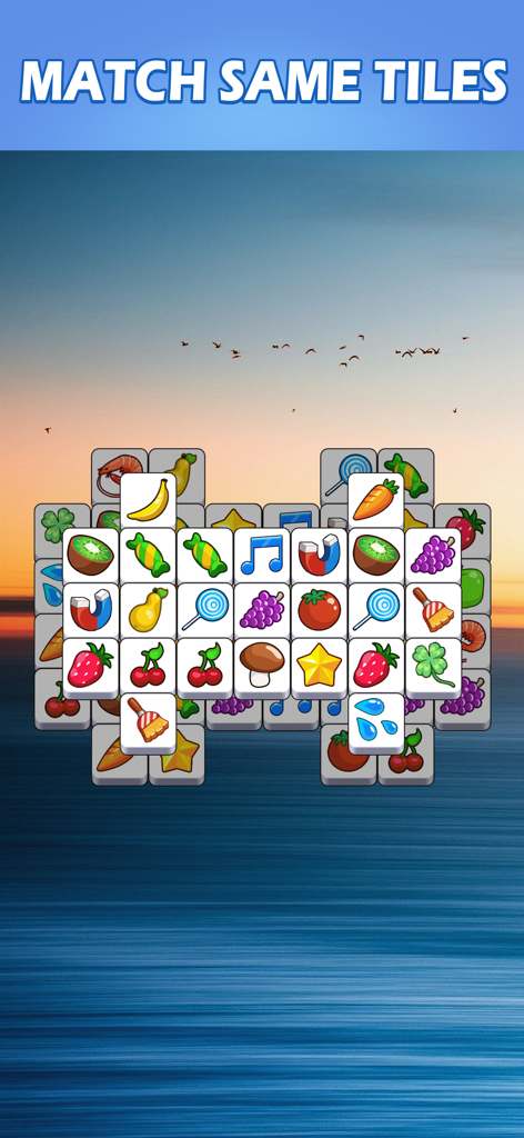 Tile Master Pro: Triple Match - Um tabuleiro de jogo de puzzle de triple match casual com frutas e ícones de objetos sobre um fundo sereno de pôr do sol no oceano