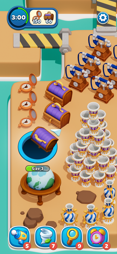 Gameplay of Hole Stars showing a black hole swallowing objects like treasure chests and vintage phones