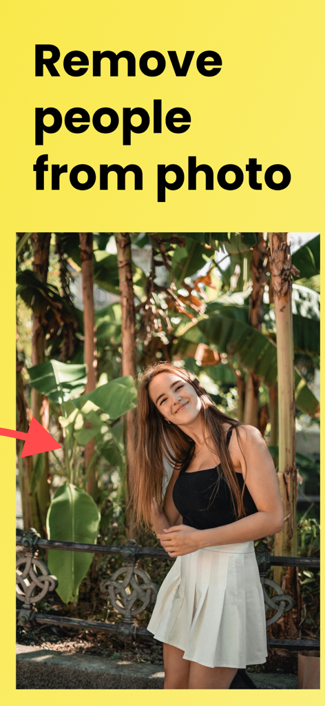 Person remover - Removex - A woman posing in front of tropical trees with a red arrow indicating where a person was removed using the Removex app.
