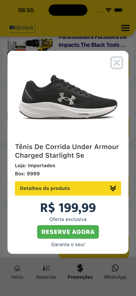 Shopping Oiapoque - Vista de detalle del producto en la aplicación Shopping Oiapoque que muestra un zapato para correr Under Armour con un botón de reserva y precio.