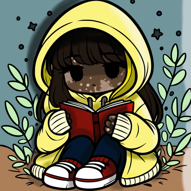 girl in oversized hoodie reading a book
