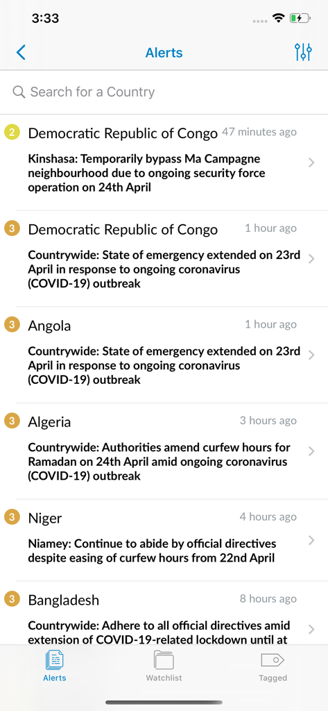 Interface of the Safe Travel by Cigna app displaying a list of real-time global security and health alerts for international business travelers.