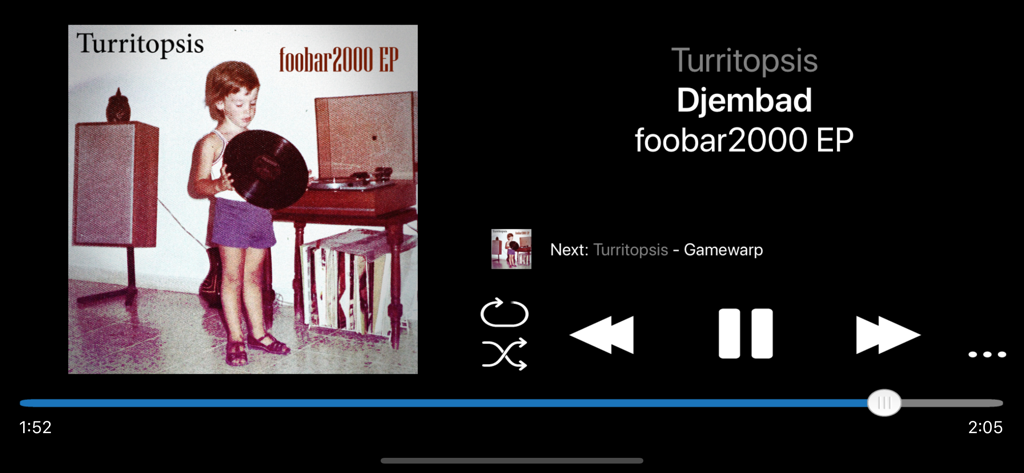 The foobar2000 music player playback screen on iOS in landscape mode showing album art and controls.