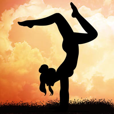 a woman doing a handstand