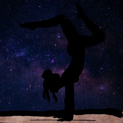 a woman doing a handstand