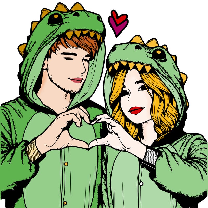 realistic couple wearing matching dinosaur onesies with heart hand gesture