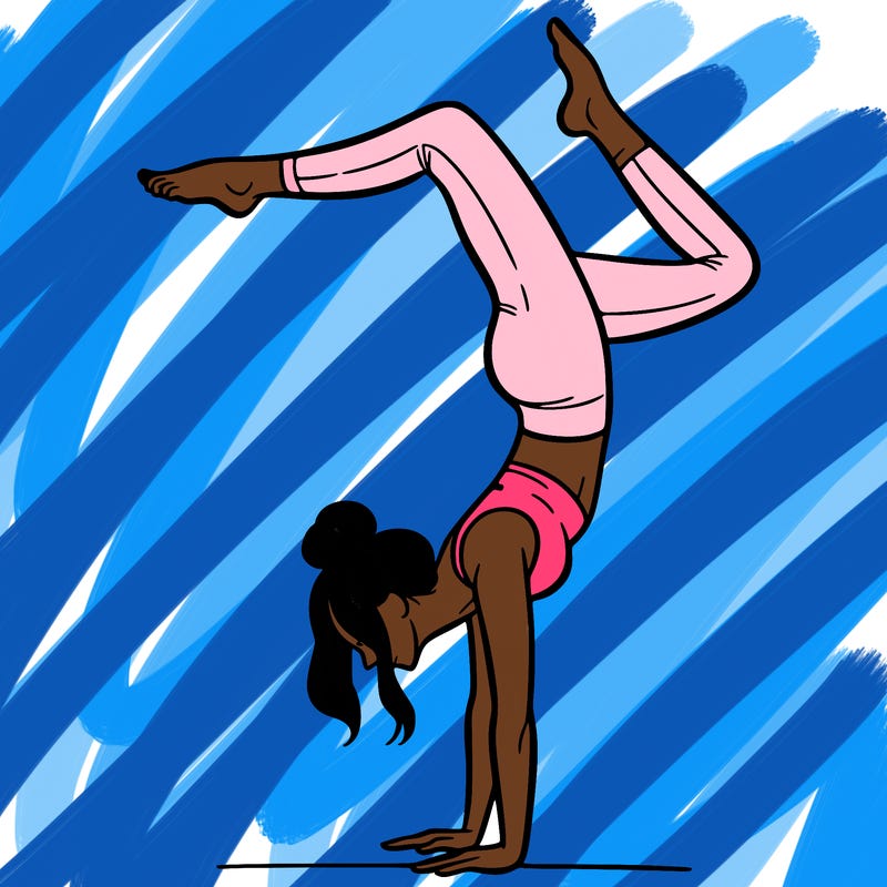 a woman doing a handstand