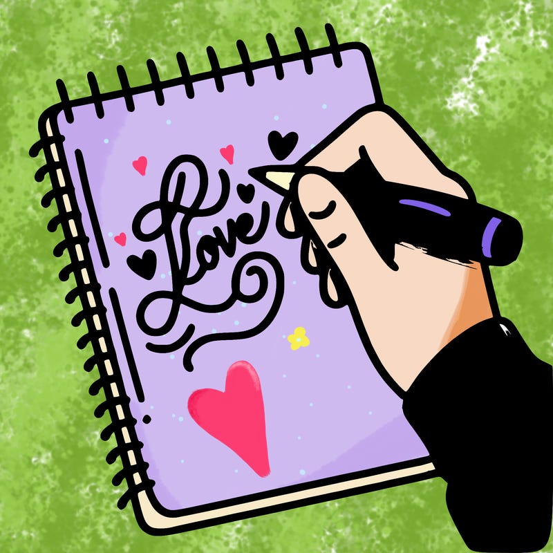 a hand writing “love” in calligraphy on a notebook