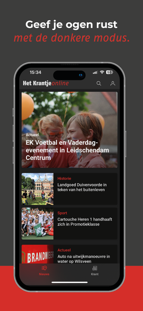 Smartphone displaying the Het Krantje local news app in dark mode interface