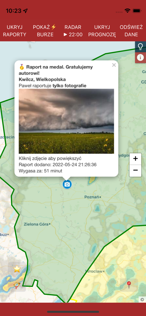 Monitor Burz weather app map showing a real time user report with a storm cloud photo