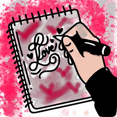 a hand writing “love” in calligraphy on a notebook
