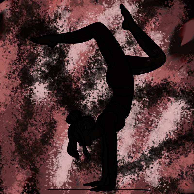 a woman doing a handstand