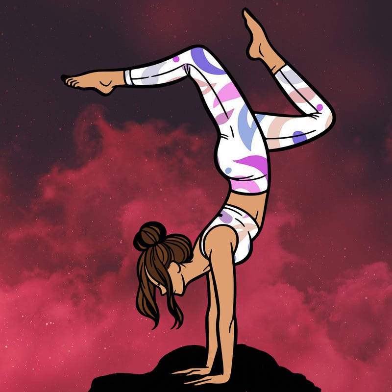 a woman doing a handstand