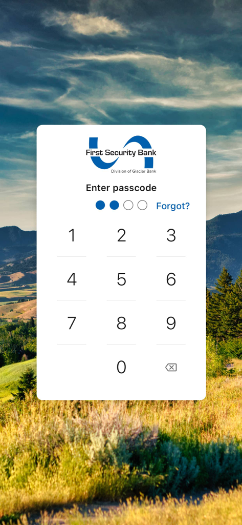 First Security Bank Bozeman - Login screen of the First Security Bank Bozeman mobile app featuring a numeric passcode entry pad over a scenic Montana landscape background.