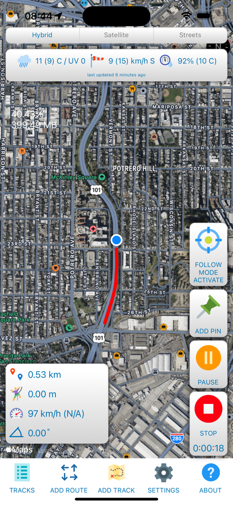 GPS tracking interface showing a red path on a satellite map with real-time speed and distance metrics