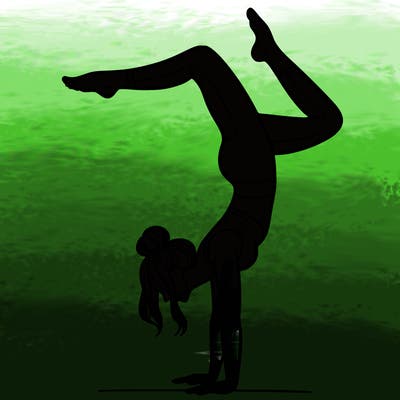 a woman doing a handstand